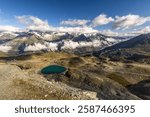 Panoramic view of the swiss alps with Weisshorn, Zinalrothorn and many other major peak with reservoir. From the top of Gornergrat, Zermatt, Switzerland.