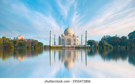 Panoramic view of Taj Mahal during bright blue sky reflected in water - Agra , Uttar Pradesh, India
