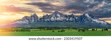 Panoramic view of Tatra mounains. Landscape of High Tatras in the spring. Snowy mountain tops and beautiful sky. [[stock_photo]] © 
