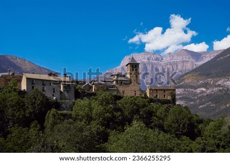 Panoramic view of Torla, a town in the Aragonese Pyrenees in the Ordesa and Monte Perdido National Park. In the background, Mount Mondarruego