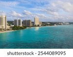 Panoramic View of Tumon Bay with City Skyline and Clear Waters