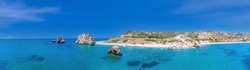 Panoramic View Of The Turquoise Waters And Cliffs Of The Cyprus Coast. Aerial Photography From Water To Shore. Aphrodite Stone District Petra Tou Romiou
