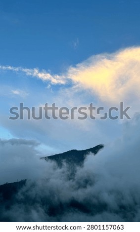 Panoramic view of a vast cloudscape taken from a high angle or airplane window.