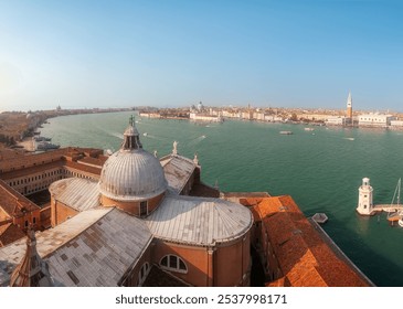 A panoramic view of Venice, Italy showcasing the city's iconic architecture and vibrant waterways during a clear sunny day - Powered by Shutterstock