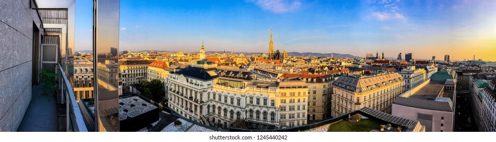 Panoramic view of Vienna at sunset from a balcony - Shutterstock ID 1245440242