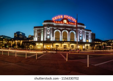 Panoramic view of vintage Union Station transportation center at dusk with streaking lights and bright lamps on August 9, 2018 in Lodo, Denver.