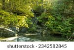 A panoramic view of waterfall over rocks in summer. Princess Louise Falls in Ottawa, Ontario, Canada.