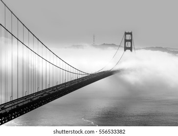 Panoramic view of the western span of the Golden Gate Bridge on a foggy winter morning viewed from Battery Spencer, a Fort Baker site - black and white rendering.

 - Powered by Shutterstock