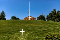 Panoramic View Of A White Marble Cross In Front Of The Pantheon And House At Arlington National Cemetery, A Military Cemetery In Washington DC, (USA).