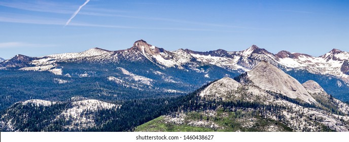 Panoramic View Of Wilderness Areas In Yosemite National Park With Mountain Peaks Covered In Snow; Sierra Nevada Mountains, California