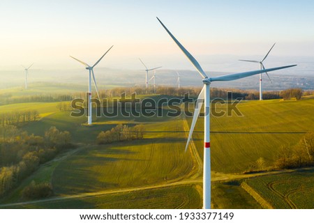 Panoramic view of wind farm or wind park, with high wind turbines for generation electricity with copy space. Green energy concept. Stok fotoğraf © 