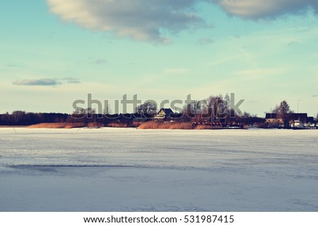 Panoramic view of winter lake. Suitable to be used to promote tourism in winter.