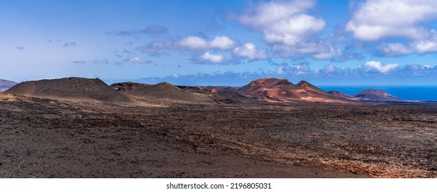 Panoramic Views Of Four Volcanoes In The Timanfaya Natural Park. Photography Made In Lanzarote, Canary Islands, Spain.