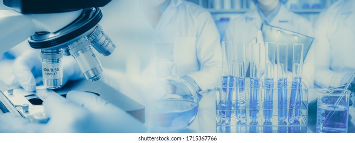 Panoramic web banner of microscope in a medical research lab or science laboratory, study for making vaccine to protection a coronavirus COVID-19