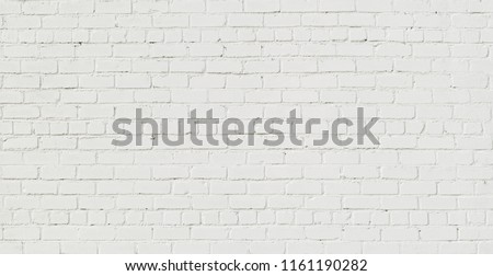 Panoramic White Brick Wall. Abstract Brickwall Background Texture. Restoring Old Brick Wall Painted Whitewash. Grunge Wide Angle Wallpaper or Web banner With Copy Space For design