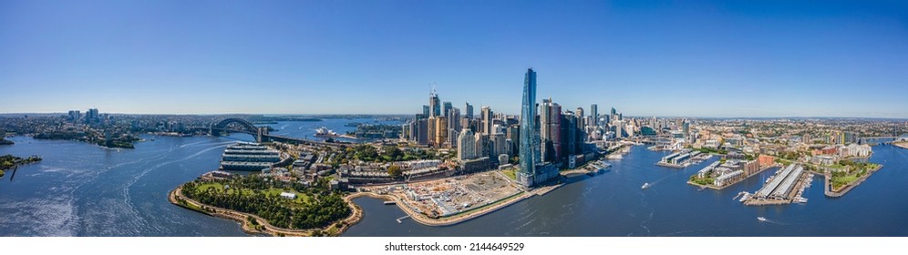 Panoramic Wide Aerial Drone View Of Sydney City Spanning From North Sydney To Pyrmont Showing The Sydney Harbour Bridge And Sydney Harbour On A Sunny Day