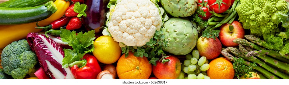 Panoramic wide organic food background concept with full frame pile of fresh vegetables and fruits mix forming bright colorful image - Shutterstock ID 632638817