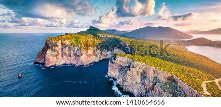 Panotamic view from flying drone. Great sunrise on Caccia cape. Breathtaking spring scene of Sardinia island, Italy, Europe. Fantastic morning seascape of Mediterranean sea. 