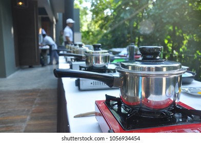 Pans And Picnic Gases Were Prepared In A Row For Outdoor Cooking Class Workshop 