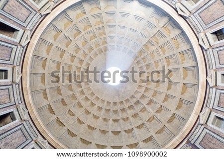 pantheon's circolar ceiling, with the famous pin hole in the middle. sunlight ray. Rome architecture's detail. Bottom view