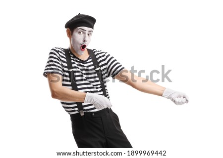 Pantomime man pulling a rope isolated on white background