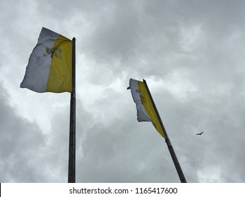 The Papal Flags Flying In Dublin City Against A Cloudy Sky On The Day Of The Papal Mass In Phoenix Park.