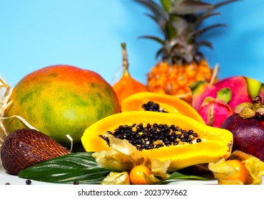 Papaya, Dragon Fruit, Mango, Mangosteen, Winter Cherry, Granadilla Salak and Pineapple. Fresh Tropical Fruits Top view Copy space