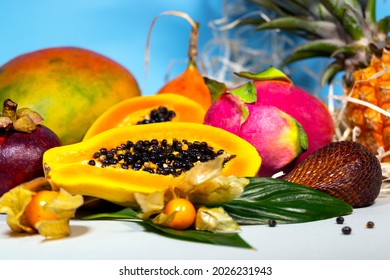 Papaya, Dragon Fruit, Mango, Mangosteen, Winter Cherry, Granadilla, Salak and Pineapple. Fresh Tropical Fruits Top view Copy space