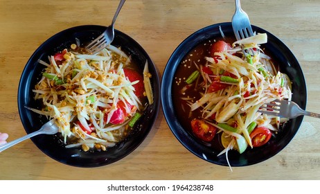 Papaya Salad, Famous Food Of Thailand, Asia, The Food Is Spicy Because It Contains Green Chili. Put Beans With Shrimp, Healthy Style, Delicious Taste, Thai People Like To Eat, Family Eating Dinner 