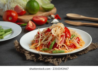 Papaya salad is a food prepared from making papaya salad.  is to sour  In Laos, it is called Tam Mak Hung.  It is cooked mainly by pounding the chopped, sliced ​​or grated green papaya in a mortar.  A