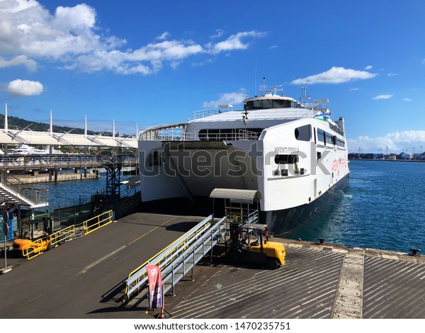 Papeete,\
Tahiti, Society Islands, French Polynesia - June 10 2019: The\
Aremiti Ferry arriving in Papeete from\
Moorea