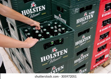 PAPENBURG, GERMANY - AUGUST 11: Stack of Holsten pilsener beer crates in a Kaufland hypermarket. Holsten Brewery is owned by the Danish company Carlsberg Group. Taken in Germany on August 11, 2015