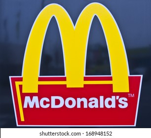 PAPENBURG, GERMANY - DEC 14: McDonald's logo  on December 14, 2013 in Papenburg, Germany. McDonald's Corporation is the world's largest chain of hamburger fast food restaurants. 
