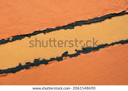 paper abstract in orange and black with a copy space - sheets of handmade paper, diagonal blank web banner, warning, alert and danger concept