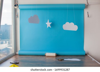 Paper Background For Birthday Baby Photoshoot. Blue Sky And Handmade Paper Cutting Stars.