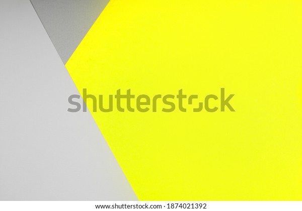 Paper background in two trendy colors\
- yellow and gray. Demonstrating colors of 2021\
year