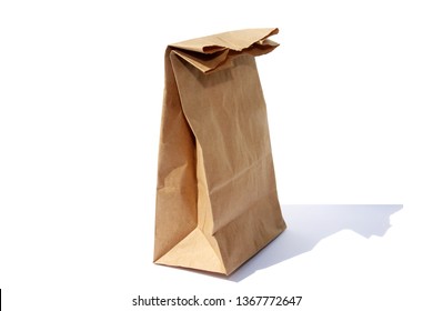 Paper Bag. Brown Paper Bag.  Isolated On White. Room For Text.  Lunch Bag On White. 