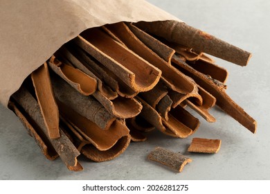 Paper Bag With Dried Cassia Cinnamon Bark Pieces Close Up  