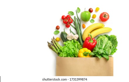 Paper bag full of different healthy food isolated on white background. Top view. - Shutterstock ID 1731399874