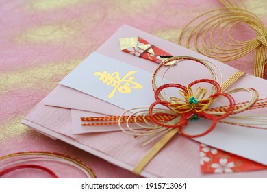 A paper bag with letters such as longevity and celebration written on it to put money in the celebration 