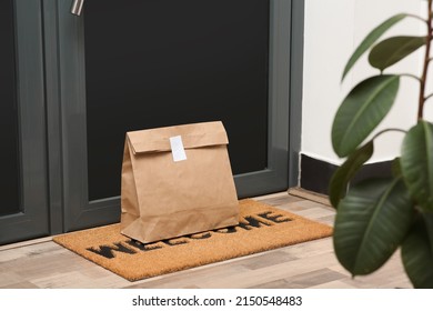 Paper Bag On Door Mat Near Entrance Indoors