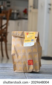 Paper Bag Packaging Design For Delivery Service Owned By Fast Food Restaurant Mc Donald Indonesia. Jakarta, August 23, 2021.