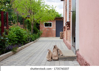 Paper Bag Takeaway Food Delivery On The Doorstep. The Concept Of Service Delivery. Space For Copying. Advertising Zone