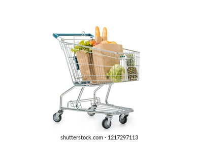 Paper Bags Full Of Products In Shopping Trolley Isolated On White