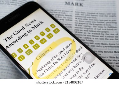 Paper Bible And Digital Bible App On Smartphone.  The New Testament. Gospel. Mark.  07-30-2018