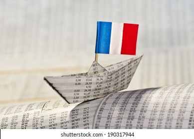 Paper Boat With Flag Of France Shipping On Financial News.