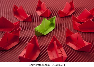 Paper boat in ocean. Red ocean marketing concept.