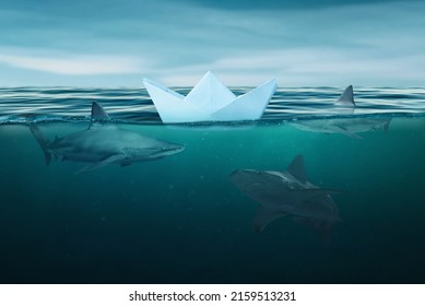 A paper boat surrounded by sharks on the high seas. The concept of audacity and weakness on a turbulent sea surrounded by competition - Shutterstock ID 2159513231
