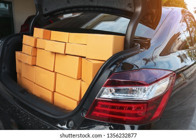 paper box post package of product in back car preparing delivery for customer order, image used for shipment logistic business concept - Shutterstock ID 1356232877