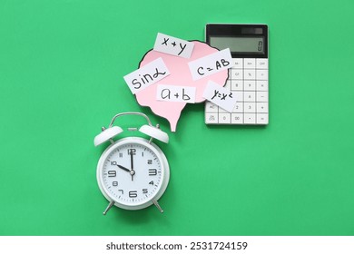 Paper brains with math formulas and equations, with calculator and alarm clock on green background - Powered by Shutterstock - Get 15% off with code: PIKWIZARD15